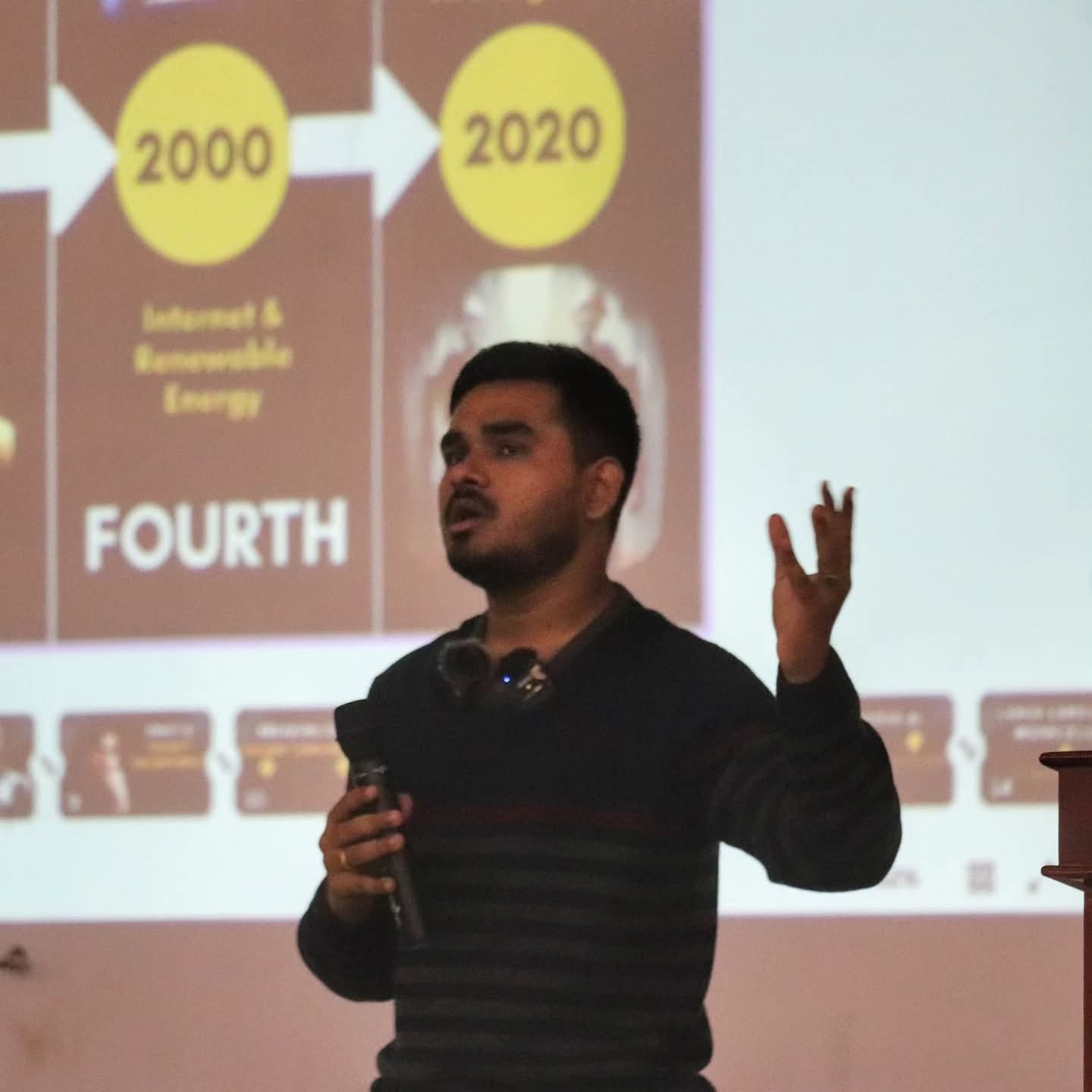 Yaswanth speaking on stage